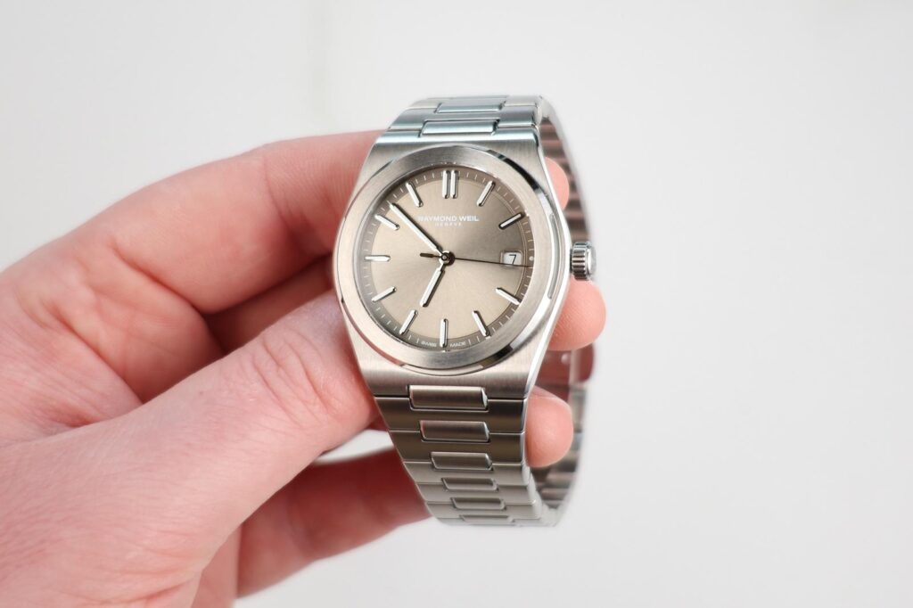 Raymond Weil A.R.T Ref. 1000 brings an integrated bracelet to the brand Raymond Weil A.R.T Ref. 1000 stainless steel integrated bracelet watch with sage grey dial