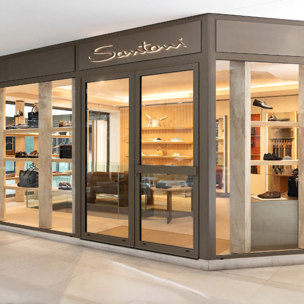Santoni Monte Carlo boutique interior with Riviera inspired luxury finishes and artisanal footwear displays