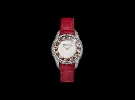 Tiffany & Co. Brings Rubies to the Sixteen Stone Watch Tiffany & Co. Sixteen Stone Mother-of-Pearl Ruby watch with ruby dial detail and red alligator strap