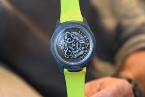 Five collaboration watches including Ulysse Nardin x Urwerk, Tudor, Tissot, Omega and Ressence models arranged on a dark editorial surface