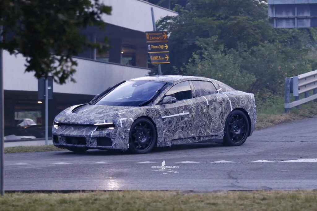 Camouflaged Ferrari Luce electric vehicle prototype on the road