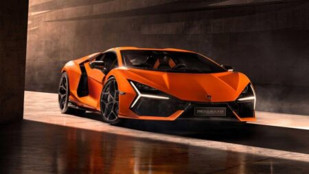 Volkswagen’s Lamborghini dilemma is starting to look more realistic Lamborghini supercar outside a modern glass automotive headquarters