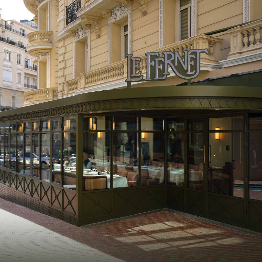Le Fernet Monte-Carlo gives Monaco a brasserie with real staying power Elegant dining room at Le Fernet Monte-Carlo with wood panelling, brass accents and white tablecloths
