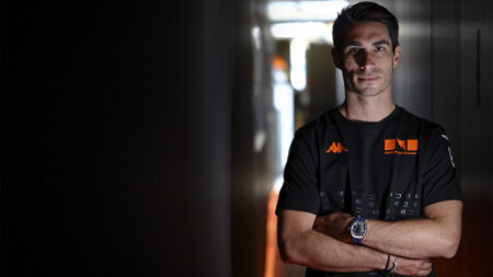 Paul-Loup Chatin Joins Lorige as a New Face of Its Motorsport Watchmaking Paul-Loup Chatin wearing a Lorige watch in a motorsport paddock setting