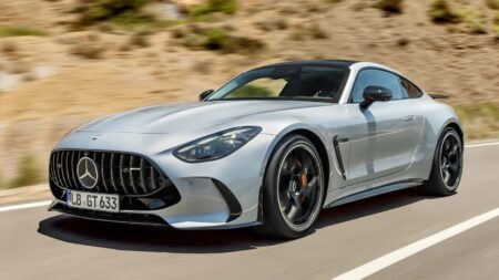 Mercedes-AMG Readies a 27-Model Push to Narrow the Gap to BMW M Mercedes-AMG performance cars lined up in a modern studio setting