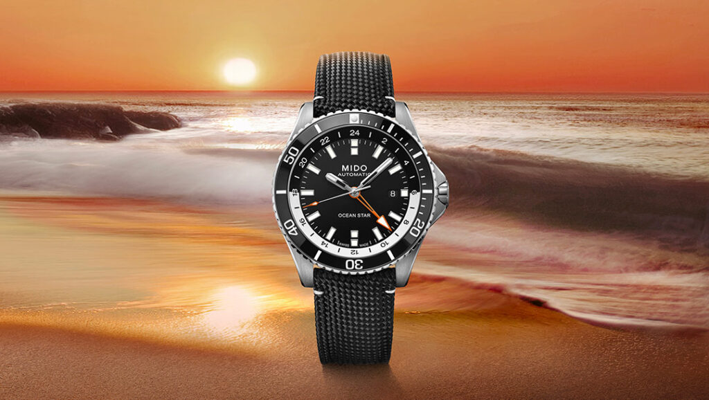 Mido Gives the Ocean Star GMT a True Travel Diver Role Mido Ocean Star GMT with black dial, orange GMT hand and black textile strap