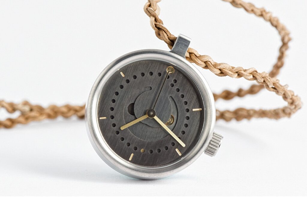 Ochs und Junior Brings Its Complications Off the Wrist Ochs und Junior pendant watch with minimalist dial, leather pouch and braided cord