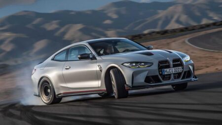 BMW Plans 8,000 Job Cuts by 2027 as It Reshapes Its Workforce BMW dealership exterior with modern vehicles displayed