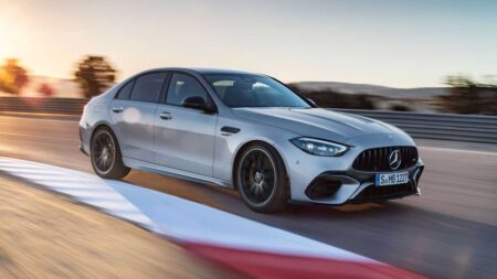 Mercedes-AMG’s V8 Comeback Looks More Plausible After New S580 Engine Mercedes-AMG performance sedan driving on a dark road with dramatic lighting
