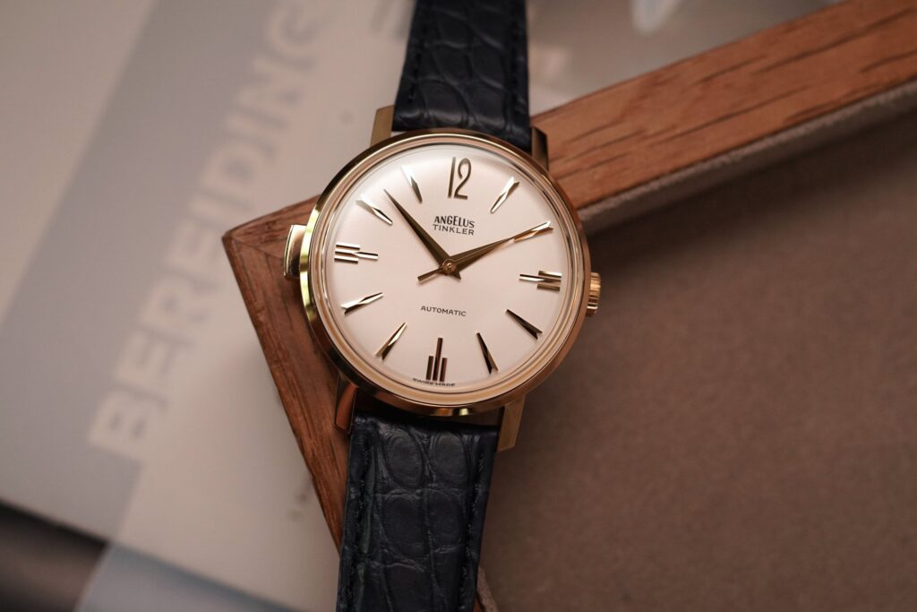 Five retro-inspired luxury watches from Angelus, Zenith, Tudor, Cartier and Oris arranged together