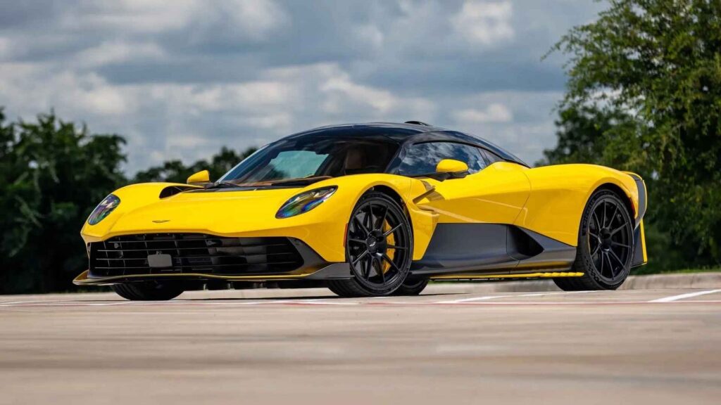 Two Nearly New Aston Martin Valhallas Are Heading to Monterey Car Week Ultra Yellow and Speedway White Aston Martin Valhalla hypercars displayed together