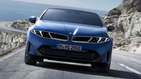 BMW’s Neue Klasse Electric Convertible Could Bring Back the Open-Top Grand Tourer BMW electric convertible concept imagined on a coastal road with the roof down