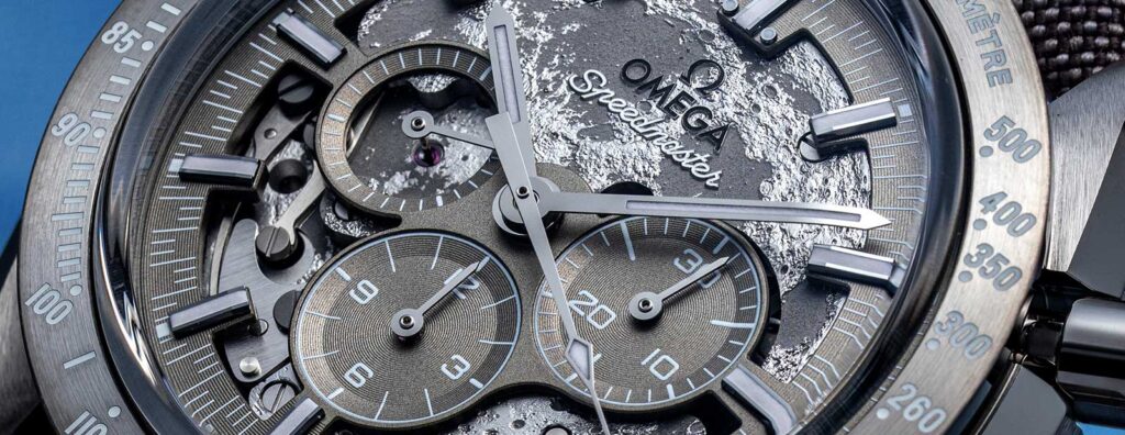 Omega Speedmaster chronograph shown with lunar surface inspired background