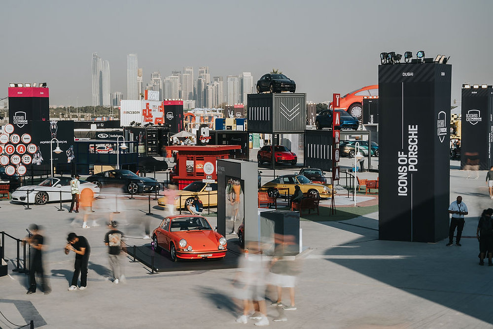 Icons of Porsche Dubai Returns in November 2026 Porsche sports cars gathered at an outdoor festival in Dubai