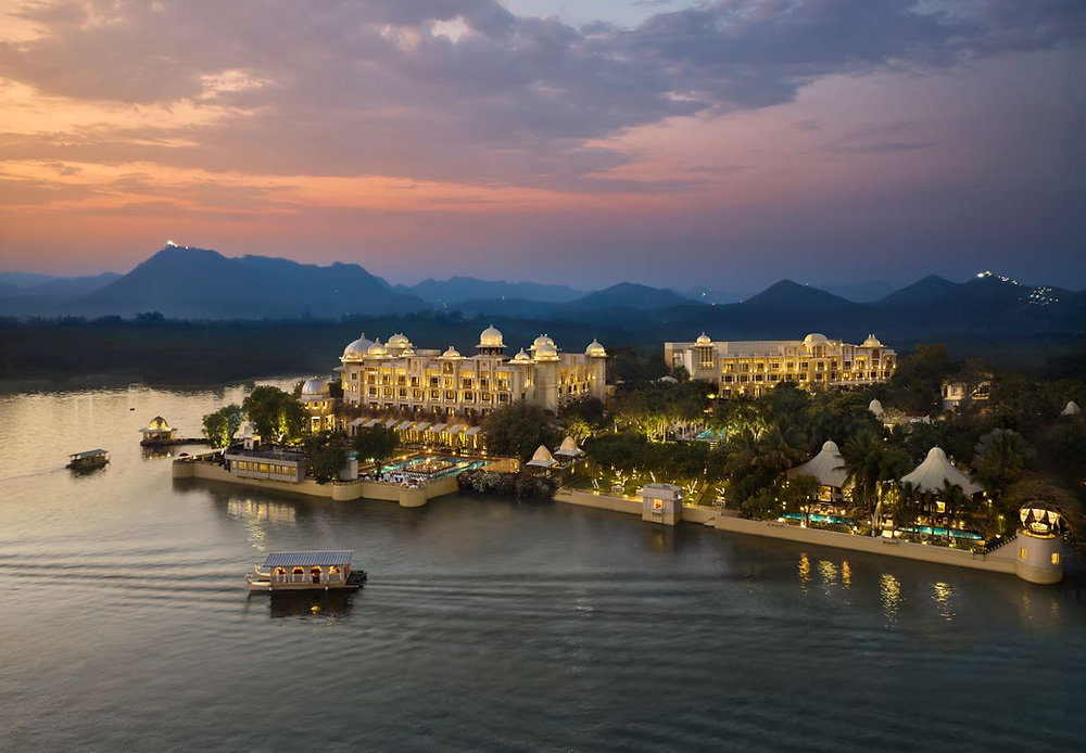 The Leela’s Global Rise Puts Indian Luxury Hospitality in the Spotlight The Leela-style Indian palace hotel exterior at golden hour with landscaped gardens and luxury hospitality atmosphere