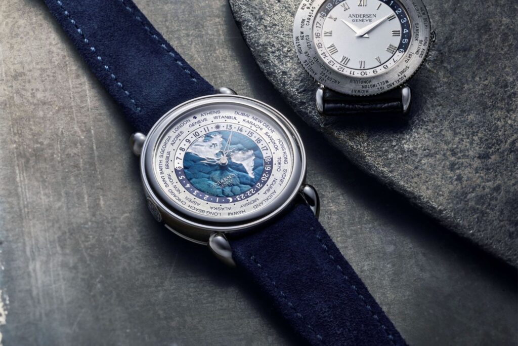 Andersen Genève Gives the Communication 45 a Platinum and Blue Finish Andersen Genève Communication 45 Platinum worldtimer with blue BlueGold dial on dark blue suede strap