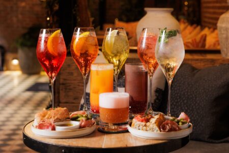 Cocktails and Italian aperitivo plates on the terrace at The Bloomsbury Club Bar in London