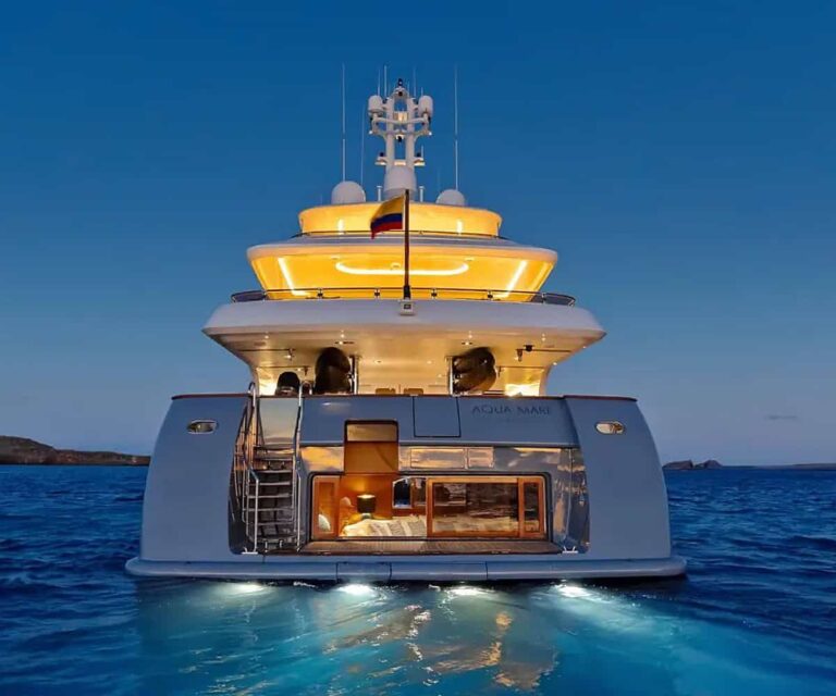 Aqua Mare superyacht cruising near volcanic coastline in the Galapagos Islands