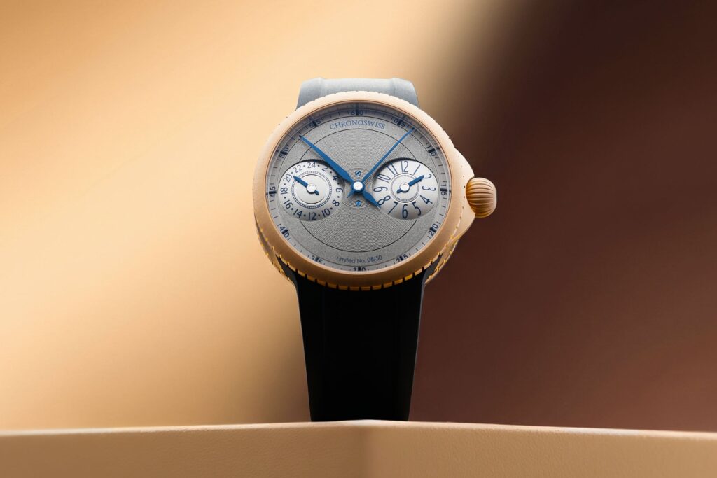 Chronoswiss Gives the Pulse GMT a Frosted Gold Treatment Chronoswiss Pulse GMT Frosted Guilloché Gold watch with frosted guilloché dial and black rubber strap