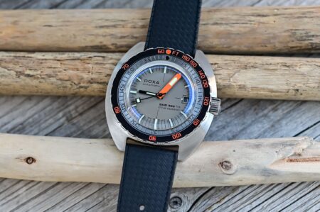 Doxa SUB 300 Ti5 Clive Cussler titanium dive watch with orange minute hand and black rubber strap