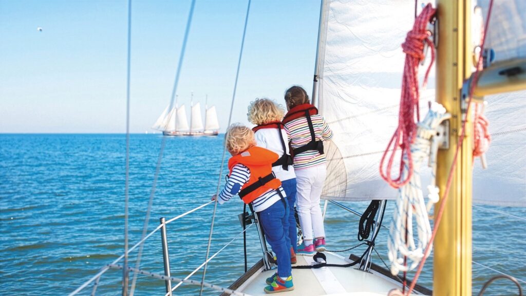 Tutors International Takes Private Education Beyond the School Gate Child studying with a private tutor aboard a luxury yacht at sea