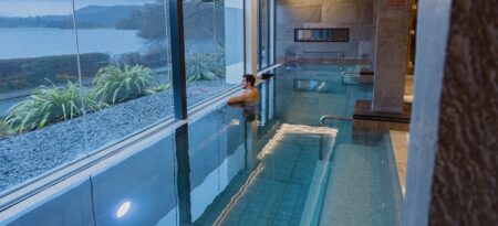 Outdoor thermal pool at Low Wood Bay Resort and Spa overlooking Lake Windermere and the surrounding fells