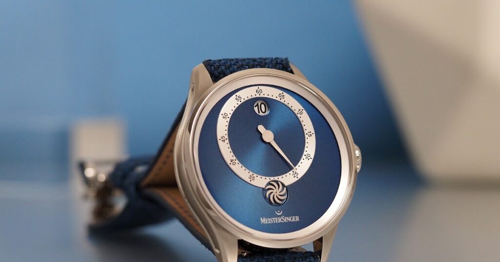 MeisterSinger’s Panthero Jumping Hour Turns Minimalism Into a Mechanical Event MeisterSinger Panthero Jumping Hour with blue sunburst dial and off-centre single-hand minute display