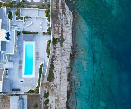 Luxury villa terrace with infinity pool overlooking the sea in Mykonos