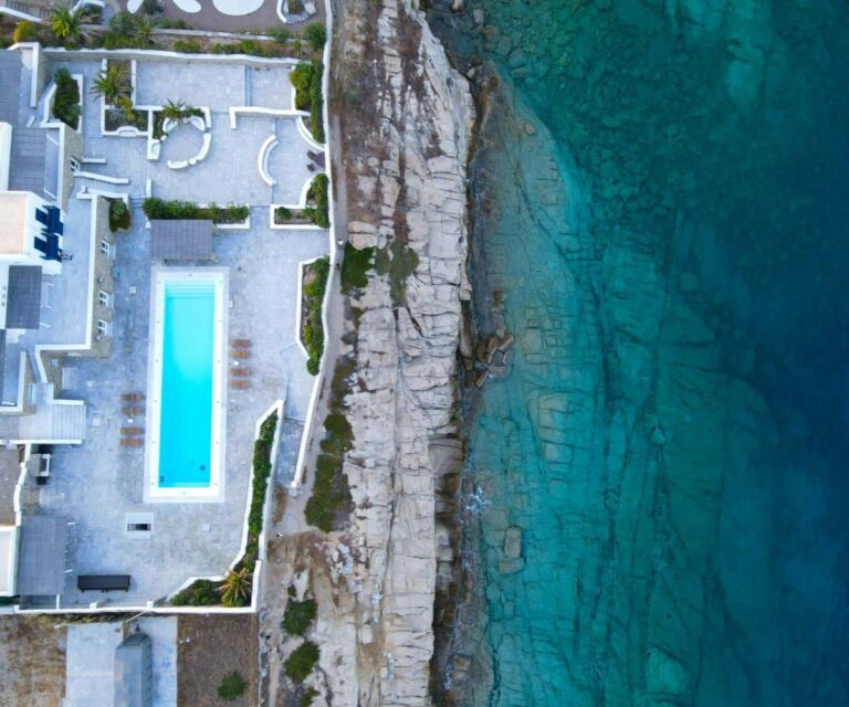How to Rent a Luxury Villa in Mykonos With Fewer Surprises Luxury villa terrace with infinity pool overlooking the sea in Mykonos