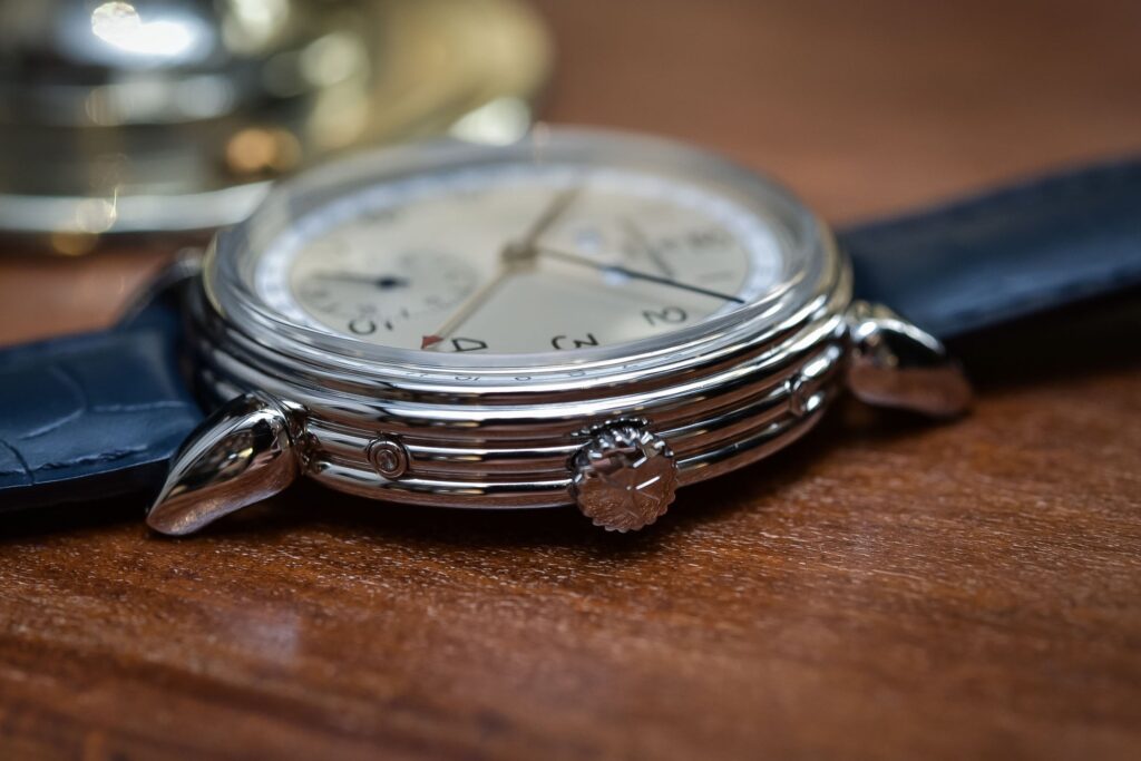 Close-up of vintage and modern wristwatch lugs showing wire lugs and spring-bar case construction
