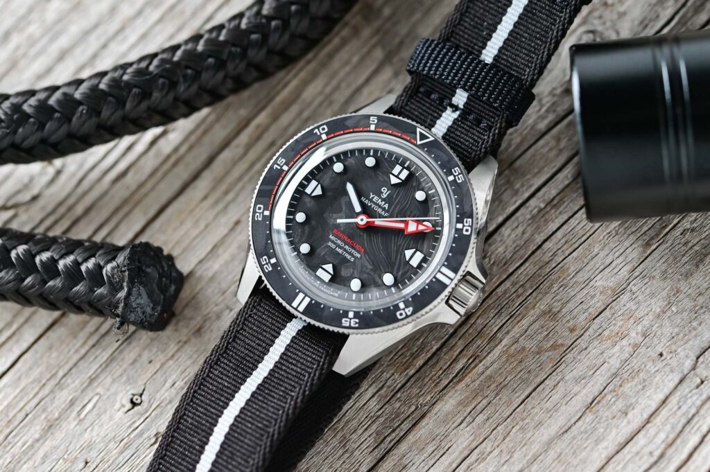Yema’s Navygraf Barracuda Brings a Submarine Edge to the CMM.20 Diver Yema Navygraf Barracuda CMM.20 Limited Edition with forged carbon dial and red minute hand
