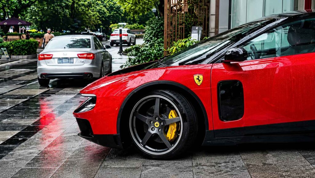 Ferrari Luce Reaches China as the Brand’s First EV Tests Its Pull Ferrari Luce EV in Rosso Fiammante displayed at a Guangzhou dealer