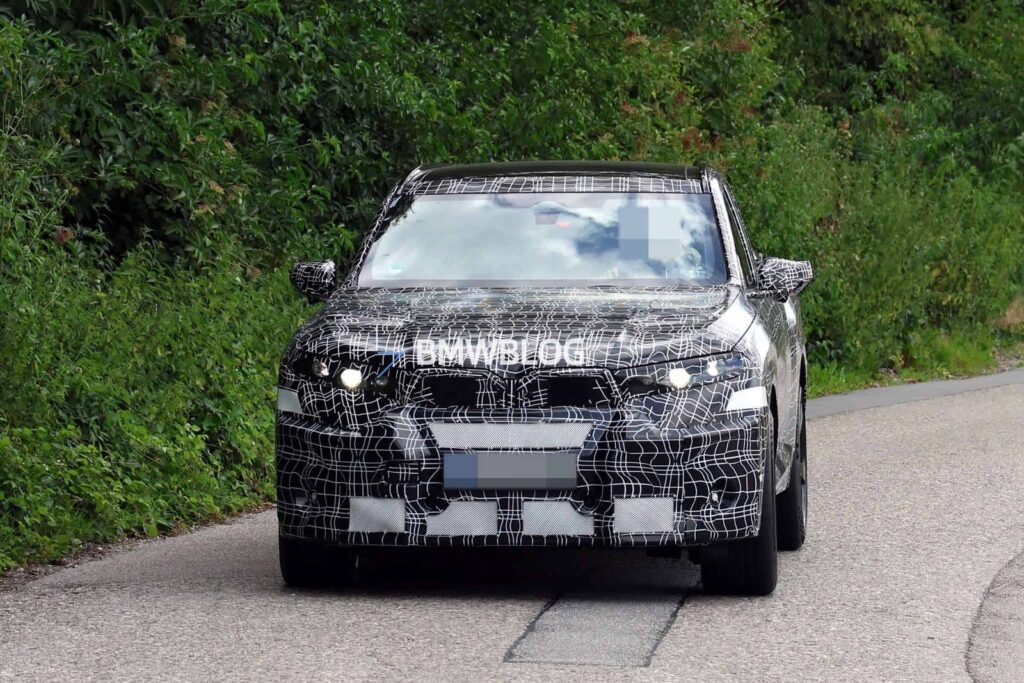 Camouflaged BMW X5 M electric prototype testing in Germany