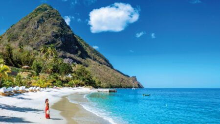 The Caribbean’s New Luxury Is Paradise With Purpose Eco-luxury Caribbean retreat overlooking turquoise water and tropical forest