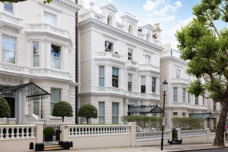 How High-Net-Worth Borrowers Are Using Mortgages, Crypto and Bridging Finance High-net-worth finance documents with a luxury watch, property plans and digital asset charts on a desk