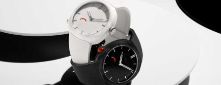 H. Moser & Cie. Streamliner Pump watches in black and white with orange pump-style pushers