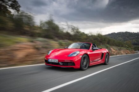 Porsche’s Electric 718 Boxster and Cayman Are Delayed but Moving Ahead Camouflaged electric Porsche 718 Boxster prototype testing on a road