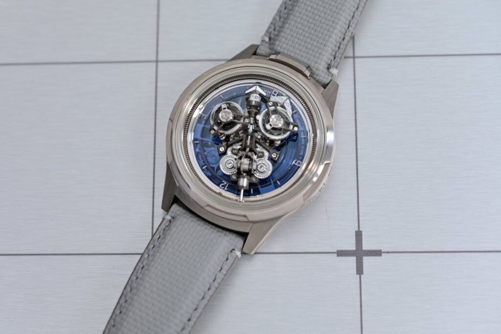 Four high-end inverted-movement watches showing their calibres from the dial side