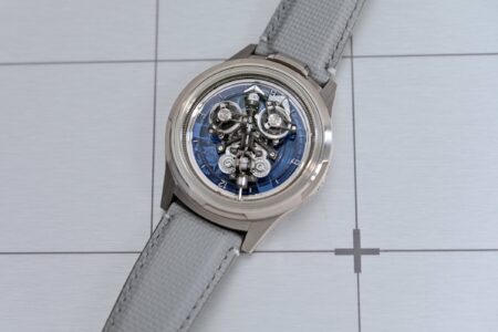 Four high-end inverted-movement watches showing their calibres from the dial side