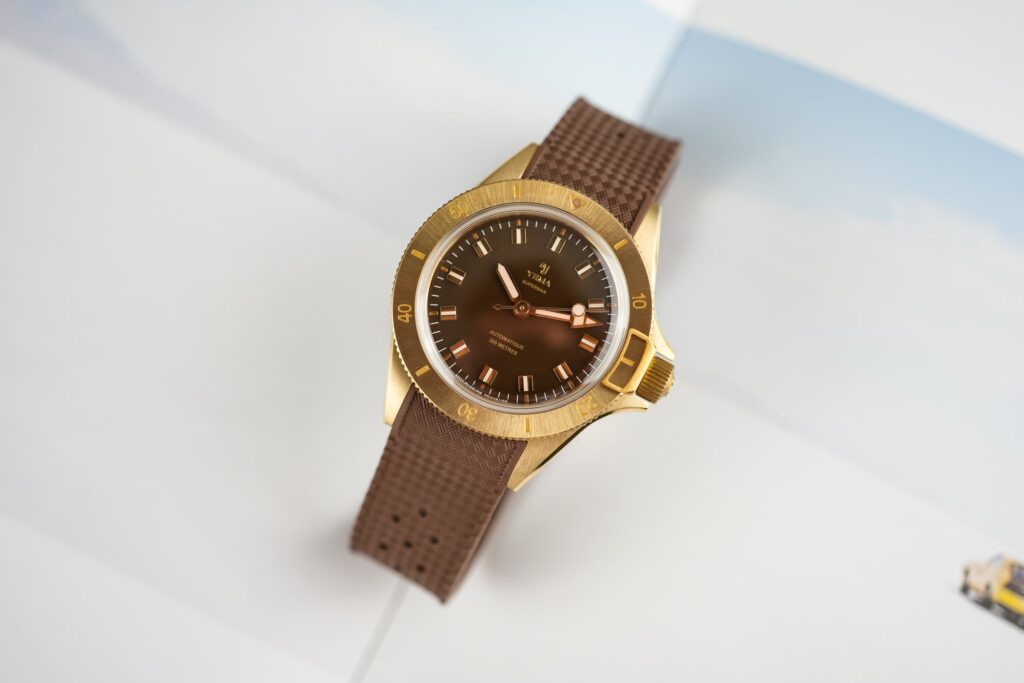 Yema Superman Bronze CMM.10 watches with brown, green and white glossy dials