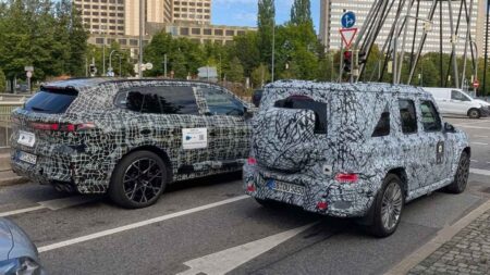 2027 BMW X5 M Prototype Towers Over Mercedes’ Smaller G-Class in Munich Camouflaged 2027 BMW X5 M prototype beside smaller Mercedes G-Class prototype in Munich