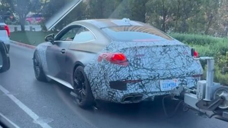 2027 Mercedes-AMG CLE 63 Prototype Brings V8 Clues and a Trailer to US Traffic Camouflaged 2027 Mercedes-AMG CLE 63 prototype towing a trailer in traffic