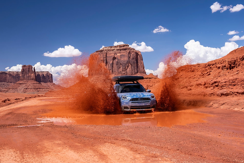 MINI Countryman Edition Heads Into the Rockies Before Its 2026 Debut Camouflaged MINI Countryman Edition testing on a rocky mountain road in the Rocky Mountains