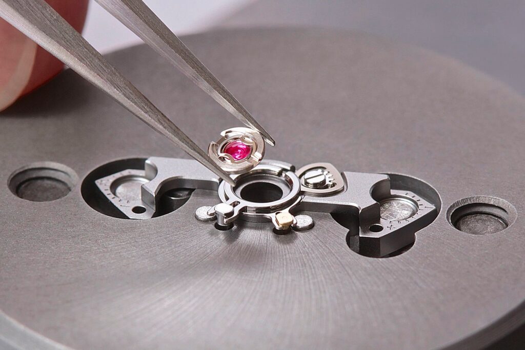 How Shock Resistance Changed the Mechanical Watch Close-up of a mechanical watch movement showing the balance assembly and shock protection system