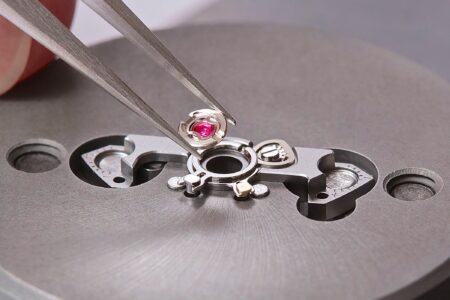 How Shock Resistance Changed the Mechanical Watch Close-up of a mechanical watch movement showing the balance assembly and shock protection system