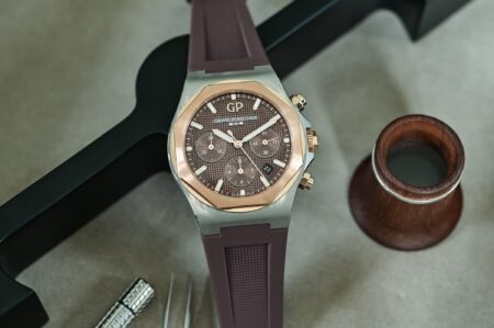 A selection of modern two-tone watches with steel, gold, ceramic and warm metal accents