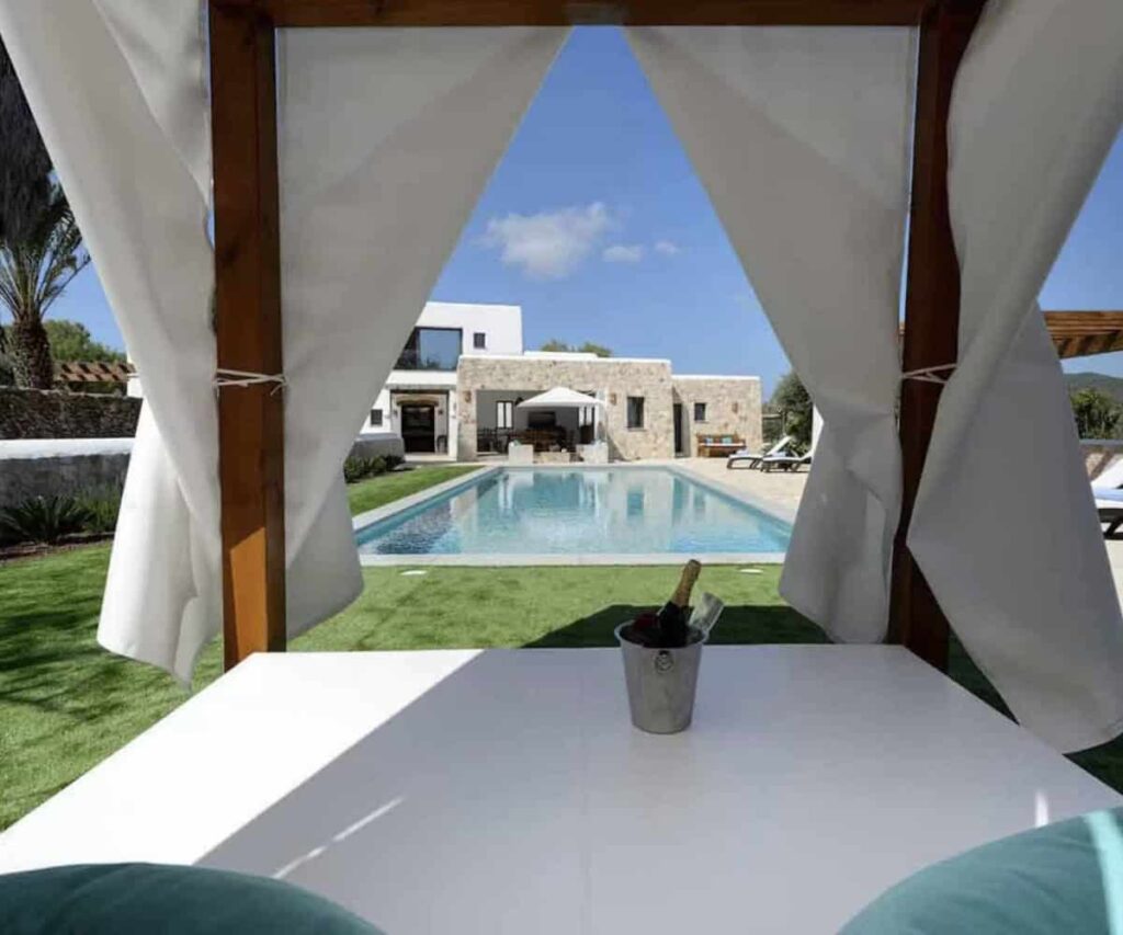 Why Travel Agencies Are Moving Spain Villa Bookings to Direct Wholesale Luxury villa with pool overlooking the Mediterranean in Ibiza