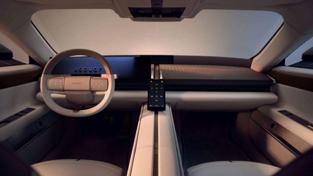 Jaguar Type 01 electric grand tourer interior with retro two-tone seats and central cabin spine