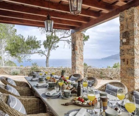 How Spain’s Local Villa Experts Are Rethinking Group Retreats Luxury Mallorca villa terrace set for a private group dinner at sunset