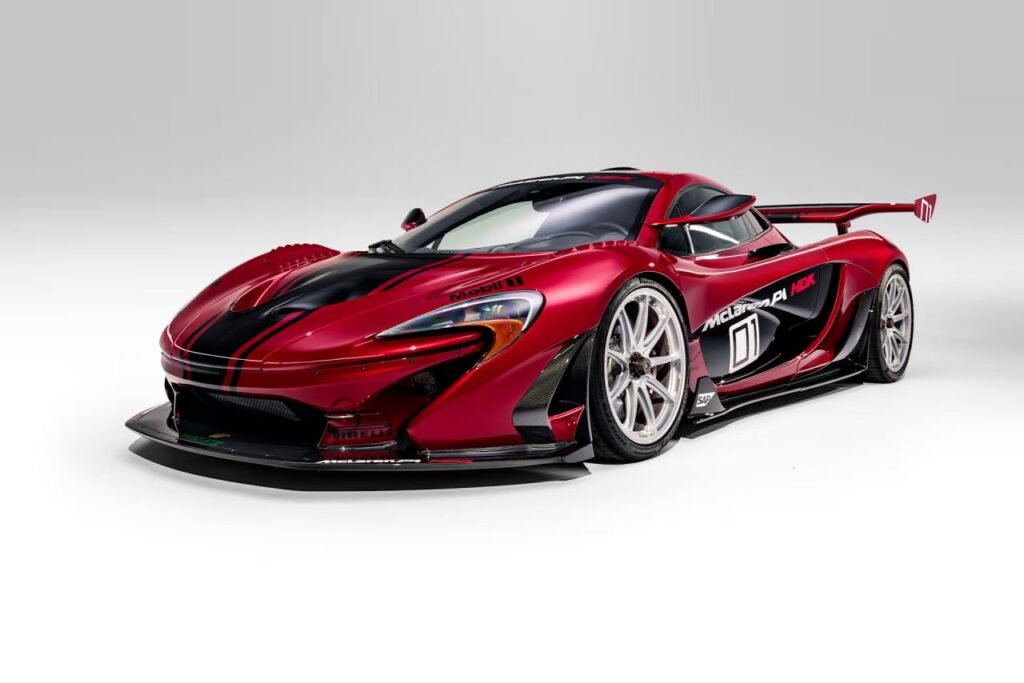 Lanzante’s Road-Legal McLaren P1 HDK Heads to Monterey Cherry Bomb Red McLaren P1 HDK by Lanzante with black stripes and fixed rear wing